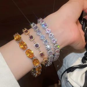 Close-up of exquisite 18k gold-plated zircon bracelets on a model's wrist.