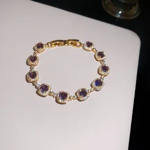 Close-up detail of 18k gold plated bracelet featuring sparkling purple zircon stones