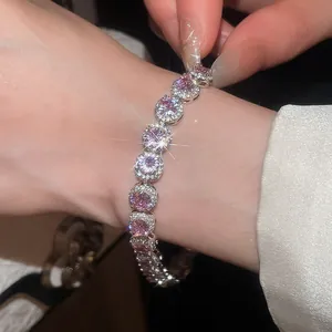Elegant close-up of 18k gold plated bracelet featuring sparkling pink cubic zirconia stones