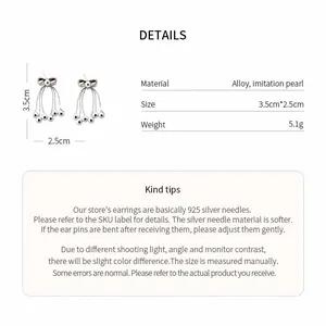Detailed view of bow tassel earrings showing size, weight, and material specifications