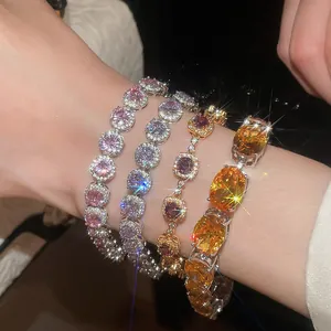 Detailed macro view of four sparkling 18k gold plated zircon bracelets worn on a wrist