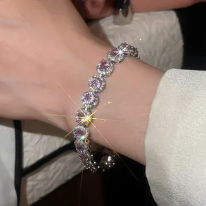 Close-up of an elegant 18k white gold plated pink zircon halo link bracelet for women