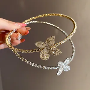 Elegant rhinestone flower chokers in gold and silver finish, showcasing sparkling crystal details.