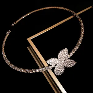 Detailed view of a sparkling luxury rhinestone choker necklace with a butterfly pendant