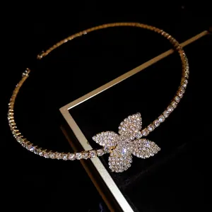 Detailed shot of a sparkling butterfly choker necklace with a gold-toned tennis chain