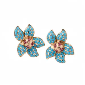 Elegant gold-tone starfish flower earrings featuring turquoise stones and pink rhinestone centers