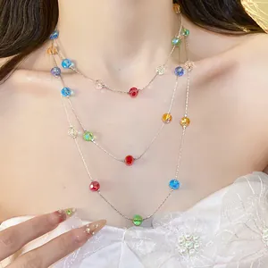 Elegant triple-layer necklace with colorful faceted glass beads on a delicate chain