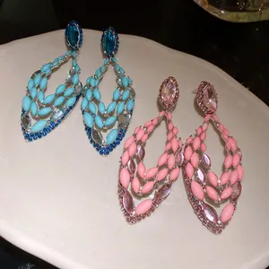 Detailed view of bohemian style hollow marquise earrings in blue and pink color variants