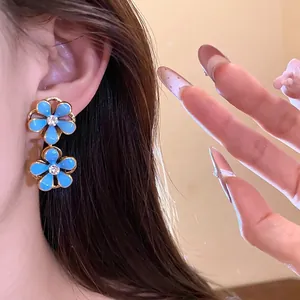 Vintage blue oil-drop flower earrings with crystal accents and gold-plated finish
