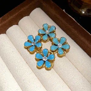 Elegant blue enamel flower stud earrings with sparkling crystals in vintage style