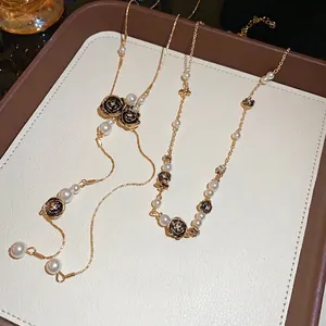 Vintage gold rose necklace with elegant pearls and tassel details for women