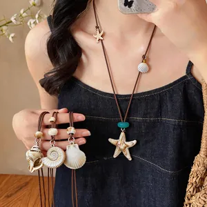 Detailed view of Bohemian starfish and seashell necklaces with natural seaside vibe