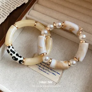Bohemian acrylic tube bead bracelet with pearls and polka dot accents