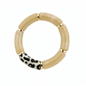 Bohemian acrylic tube bracelet featuring beige marble finish and leopard print accent bead