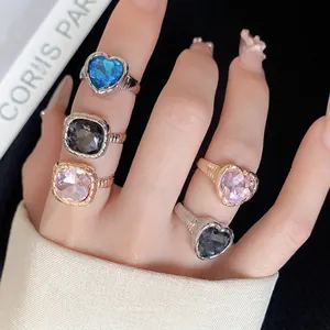 Main view of European style heart and square gemstone open rings set in gold and silver