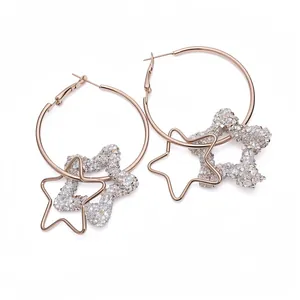 Elegant rose gold hoop earrings featuring a double star pendant with sparkling resin stones