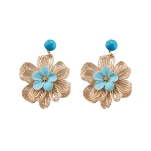 Exquisite handcrafted raffia woven flower stud earrings in light blue and beige summer style