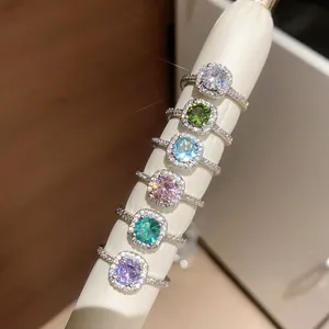 Detailed macro view of luxury zircon halo rings in various sparkling candy colors