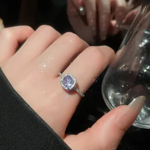 Elegant lavender zircon adjustable halo ring showing sparkling crystal details on hand