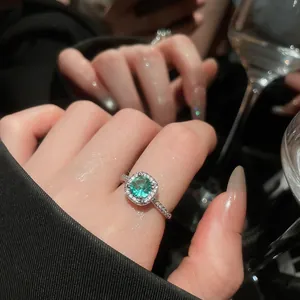 Exquisite close-up of a luxury round candy-colored zircon ring worn on an elegant hand