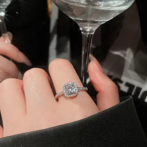 Close-up of elegant circular zircon halo ring with shimmering pavé band details.