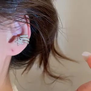 Detailed shot of Korean style silver ear cuff with zircon pentagram star design