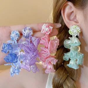 Elegant chiffon flower and pearl drop earrings in vibrant colors for beach vacations.