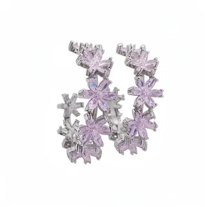 Elegant C-shaped silver hoop earrings featuring sparkling pink zircon flower designs.