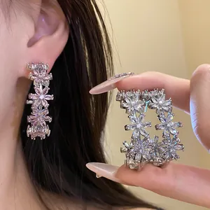 Elegant C-shaped floral earrings with sparkling cubic zirconia in silver and pink