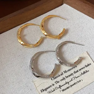 Elegant 18k gold plated C-shaped hoop earrings with zircon accents and silver pins