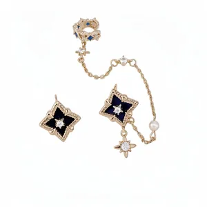Luxury gold jewelry set featuring zircon rhombus and star motifs on white background