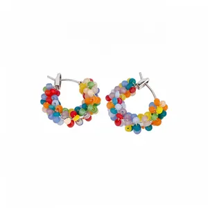 Handcrafted colorful seed bead wrapped hoop earrings with retro aesthetic