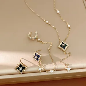 Macro view of the zircon star jewelry set featuring a necklace and drop earrings