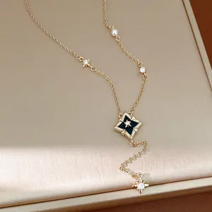Detailed close-up view of an elegant gold necklace with zircon rhombus star pendant