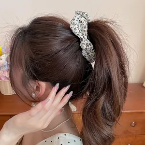 Elegant floral pattern fabric bow banana hair clip for stylish women's ponytail accessory