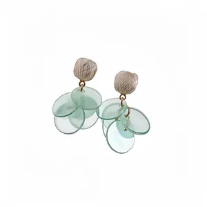 Elegant silver needle cat eye stone earrings with light green translucent disc tassels.