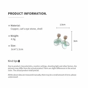 Detail view of cat's eye stone earrings with material, weight, and size specifications.