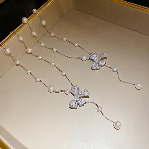 Elegant pearl necklace with sparkling zircon bow pendant in French vintage style