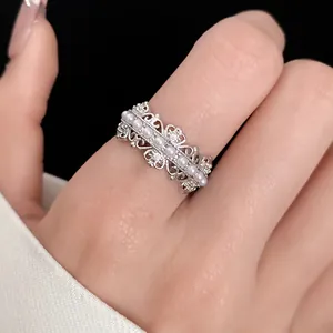 Macro view of elegant hollow silver ring with delicate pearls and sparkling zircon details
