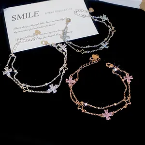 Detail showing three colors of sparkling double-layer flower zircon bracelets on black velvet