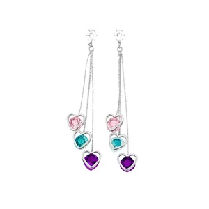 Elegant long tassel earrings featuring colorful heart-shaped cubic zirconia crystals and silver finish.