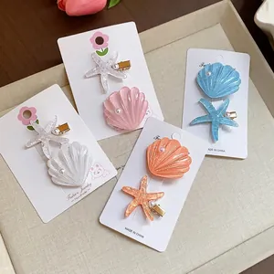 Elegant set of resin starfish and shell hair clips for a stylish beach vacation look