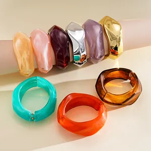 Detailed collection of colorful irregular geometric resin and metallic open bangles