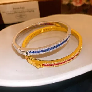 Retro palace style zircon bangle set with blue and red stones and buckle closure