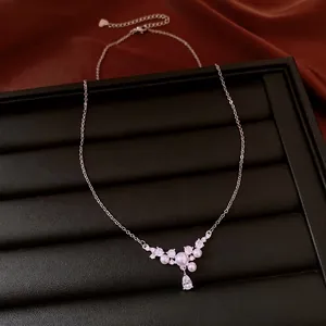 Elegant zircon and waterdrop pearl necklace for women displayed on black jewelry tray