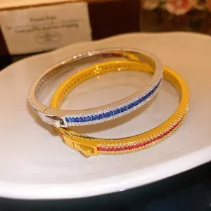 Detailed macro view of luxury vintage style zircon bangles with elegant circular buckle
