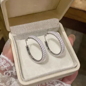 Elegant silver-tone hoop earrings with double-row faux pearls presented in a luxury gift box