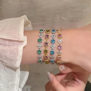 Elegant 18k gold plated bracelet set with floral zircon and colorful gemstones on wrist