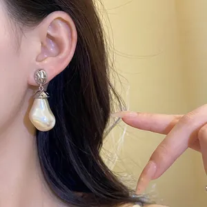 Elegant vintage silver hammered drop earrings with irregular large baroque pearl pendant