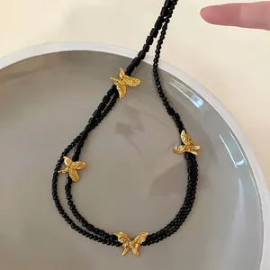 French vintage multi-layer necklace with black beads and gold butterfly charms